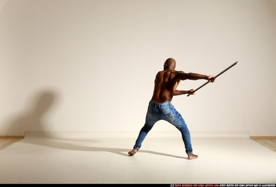 Man Adult Athletic Black Fighting with spear Moving poses Pants