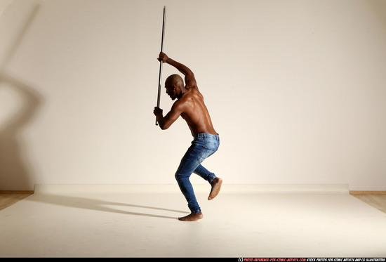 Man Adult Athletic Black Fighting with spear Moving poses Pants