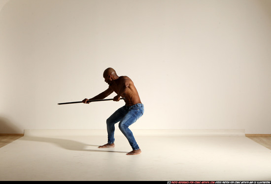 Man Adult Athletic Black Fighting with spear Moving poses Pants