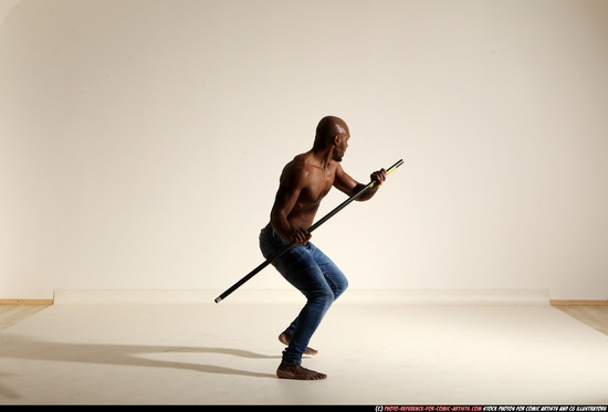 Man Adult Athletic Black Fighting with spear Moving poses Pants