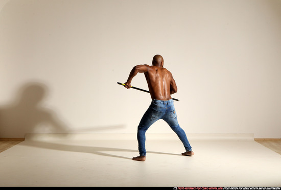 Man Adult Athletic Black Fighting with spear Moving poses Pants