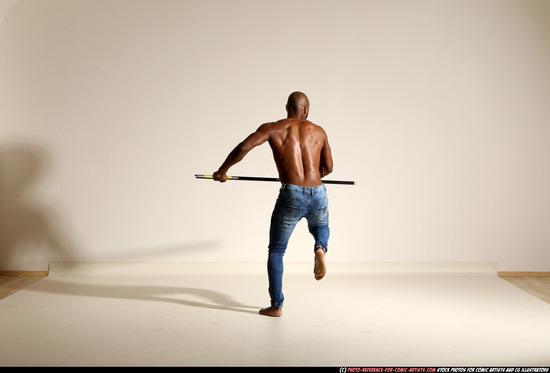 Man Adult Athletic Black Fighting with spear Moving poses Pants