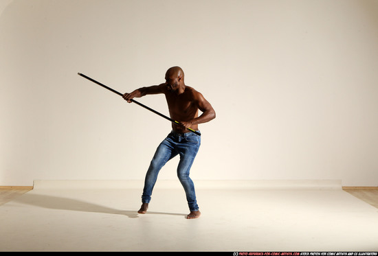 Man Adult Athletic Black Fighting with spear Moving poses Pants