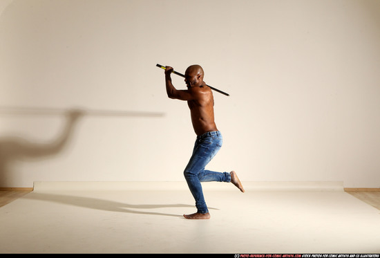 Man Adult Athletic Black Fighting with spear Moving poses Pants