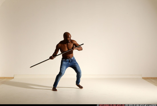 Man Adult Athletic Black Fighting with spear Moving poses Pants