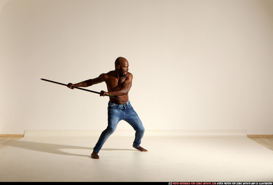 Man Adult Athletic Black Fighting with spear Moving poses Pants