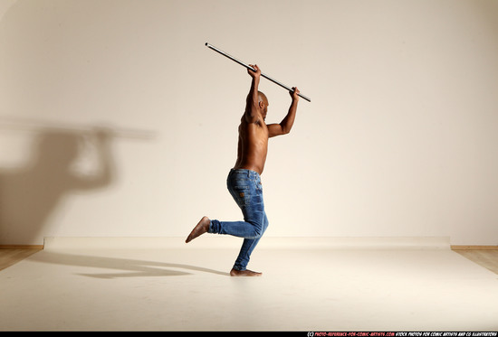 Man Adult Athletic Black Fighting with spear Moving poses Pants