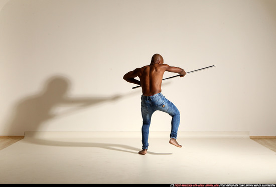 Man Adult Athletic Black Fighting with spear Moving poses Pants