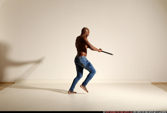 Man Adult Athletic Black Fighting with spear Moving poses Pants