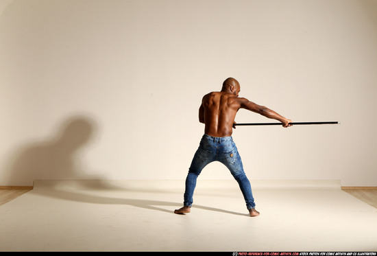 Man Adult Athletic Black Fighting with spear Moving poses Pants