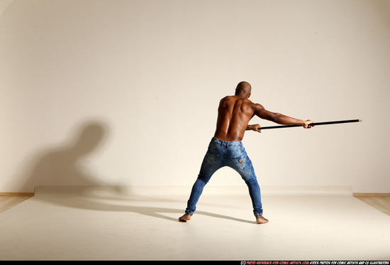 Man Adult Athletic Black Fighting with spear Moving poses Pants