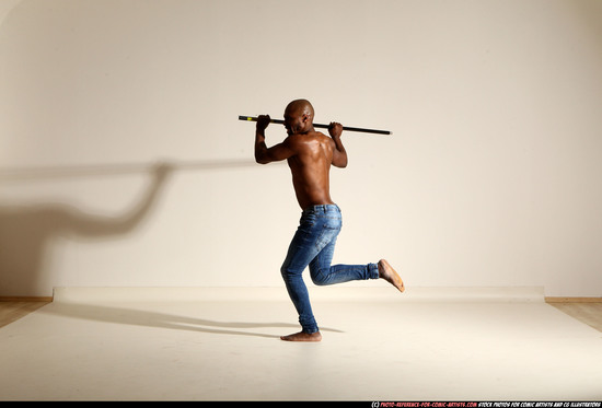 Man Adult Athletic Black Fighting with spear Moving poses Pants