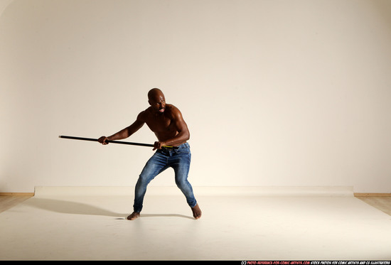 Man Adult Athletic Black Fighting with spear Moving poses Pants