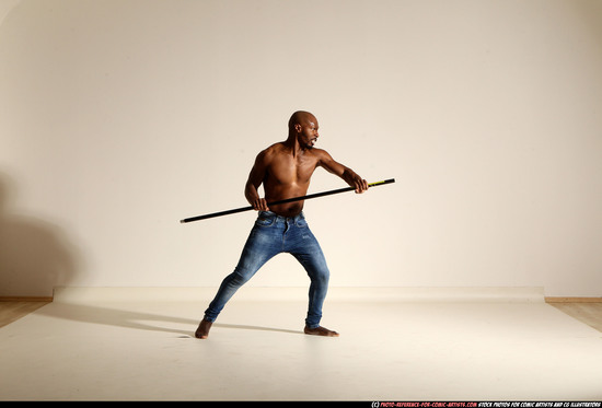 Man Adult Athletic Black Fighting with spear Moving poses Pants