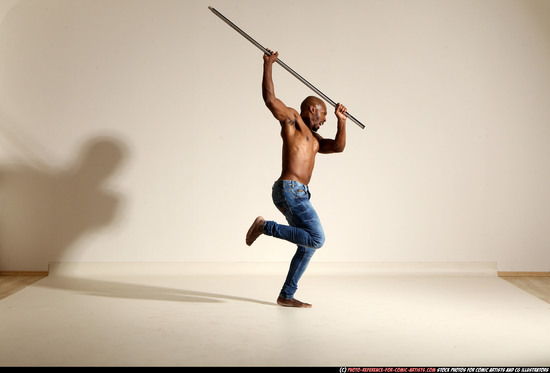 Man Adult Athletic Black Fighting with spear Moving poses Pants