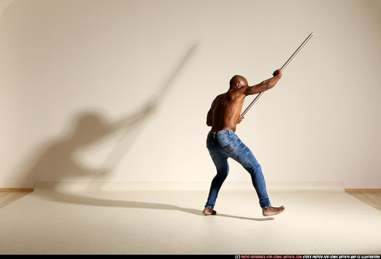 Man Adult Athletic Black Fighting with spear Moving poses Pants