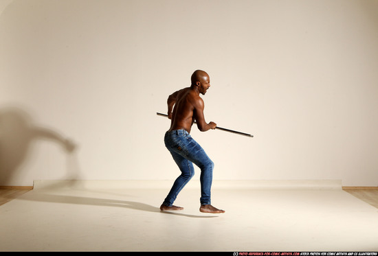 Man Adult Athletic Black Fighting with spear Moving poses Pants