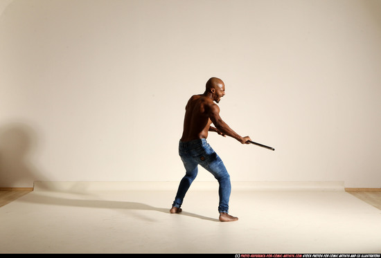 Man Adult Athletic Black Fighting with spear Moving poses Pants