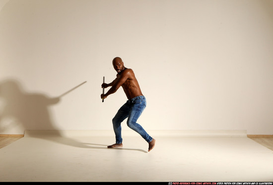 Man Adult Athletic Black Fighting with spear Moving poses Pants