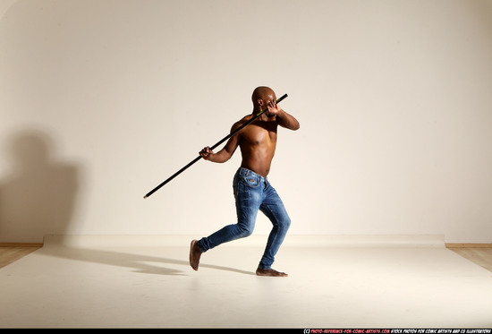 Man Adult Athletic Black Fighting with spear Moving poses Pants