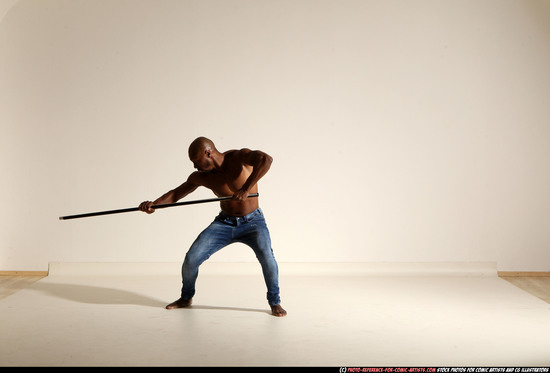 Man Adult Athletic Black Fighting with spear Moving poses Pants