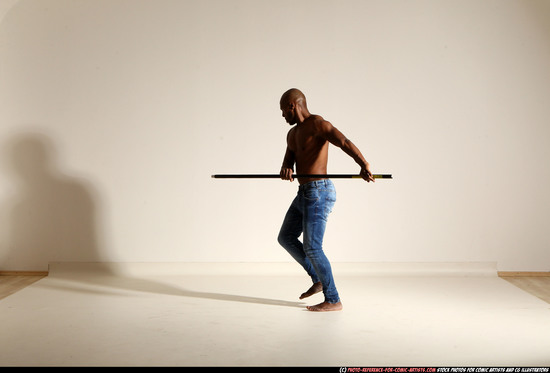 Man Adult Athletic Black Fighting with spear Moving poses Pants