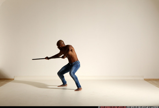 Man Adult Athletic Black Fighting with spear Moving poses Pants