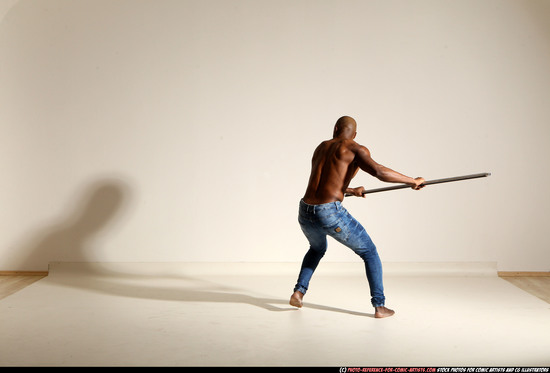 Man Adult Athletic Black Fighting with spear Moving poses Pants