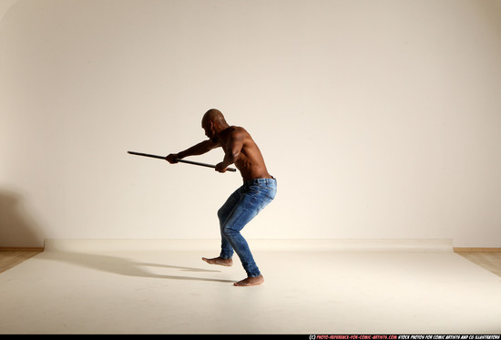 Man Adult Athletic Black Fighting with spear Moving poses Pants