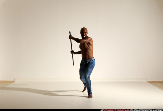 Man Adult Athletic Black Fighting with spear Moving poses Pants