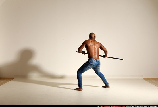 Man Adult Athletic Black Fighting with spear Moving poses Pants