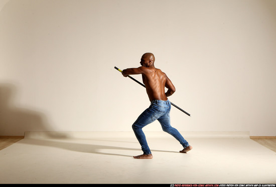 Man Adult Athletic Black Fighting with spear Moving poses Pants