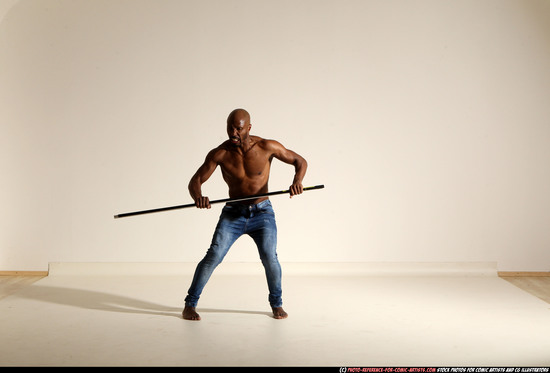 Man Adult Athletic Black Fighting with spear Moving poses Pants