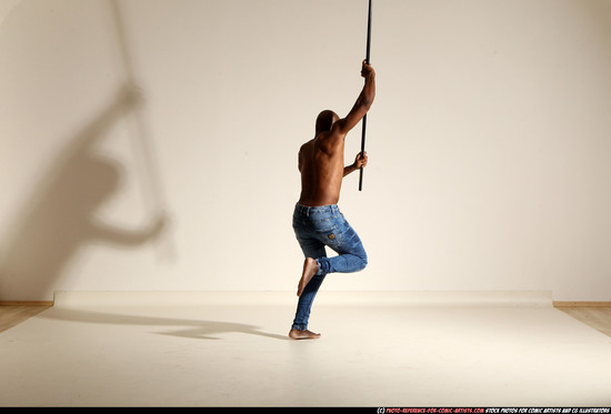 Man Adult Athletic Black Fighting with spear Moving poses Pants