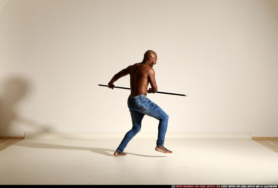 Man Adult Athletic Black Fighting with spear Moving poses Pants