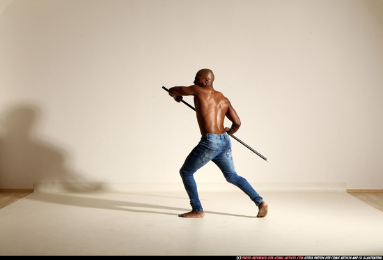 Man Adult Athletic Black Fighting with spear Moving poses Pants