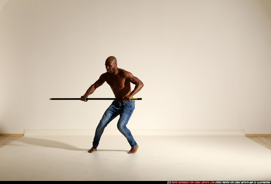 Man Adult Athletic Black Fighting with spear Moving poses Pants