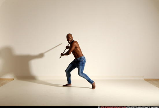 Man Adult Athletic Black Fighting with spear Moving poses Pants