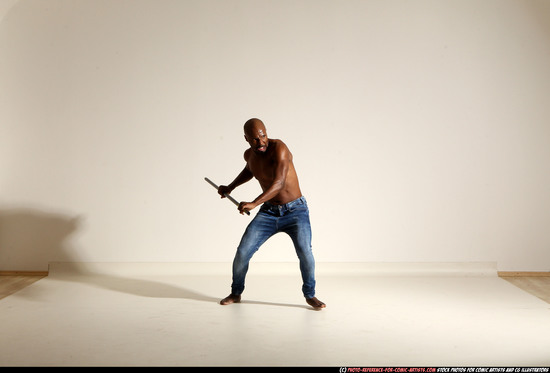 Man Adult Athletic Black Fighting with spear Moving poses Pants