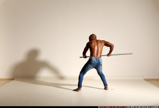 Man Adult Athletic Black Fighting with spear Moving poses Pants