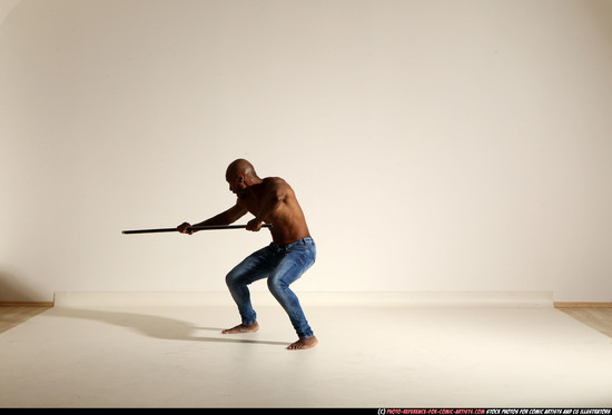 Man Adult Athletic Black Fighting with spear Moving poses Pants