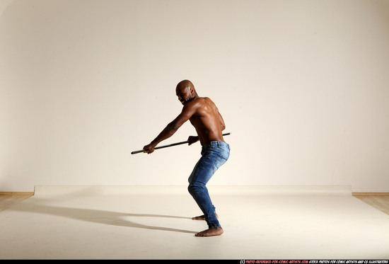 Man Adult Athletic Black Fighting with spear Moving poses Pants