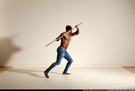 Man Adult Athletic Black Fighting with spear Moving poses Pants