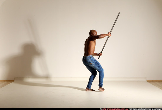 Man Adult Athletic Black Fighting with spear Moving poses Pants