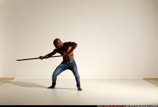 Man Adult Athletic Black Fighting with spear Moving poses Pants