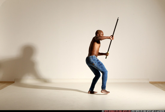 Man Adult Athletic Black Fighting with spear Moving poses Pants