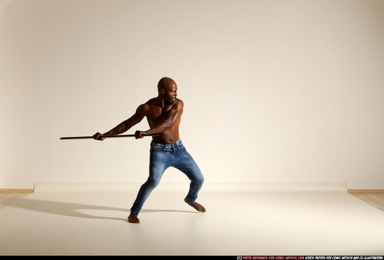 Man Adult Athletic Black Fighting with spear Moving poses Pants