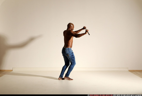 Man Adult Athletic Black Fighting with spear Moving poses Pants