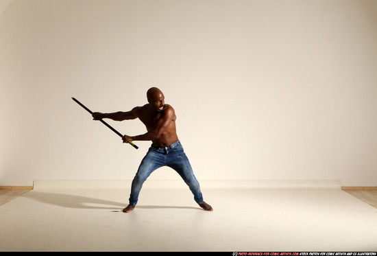 Man Adult Athletic Black Fighting with spear Moving poses Pants