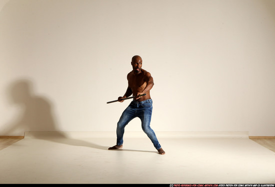 Man Adult Athletic Black Fighting with spear Moving poses Pants